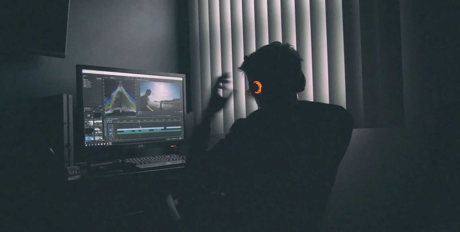 Video editor at a monitor with a timeline open