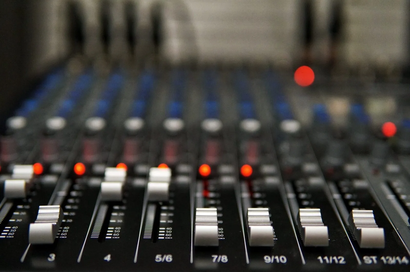 Faders on an audio mixing desk