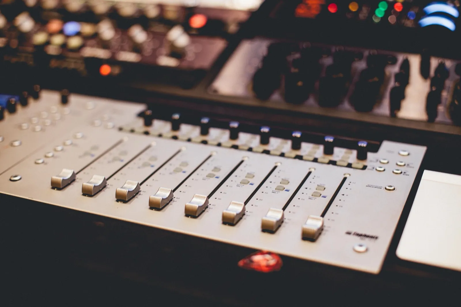 Faders on a studio mixing console