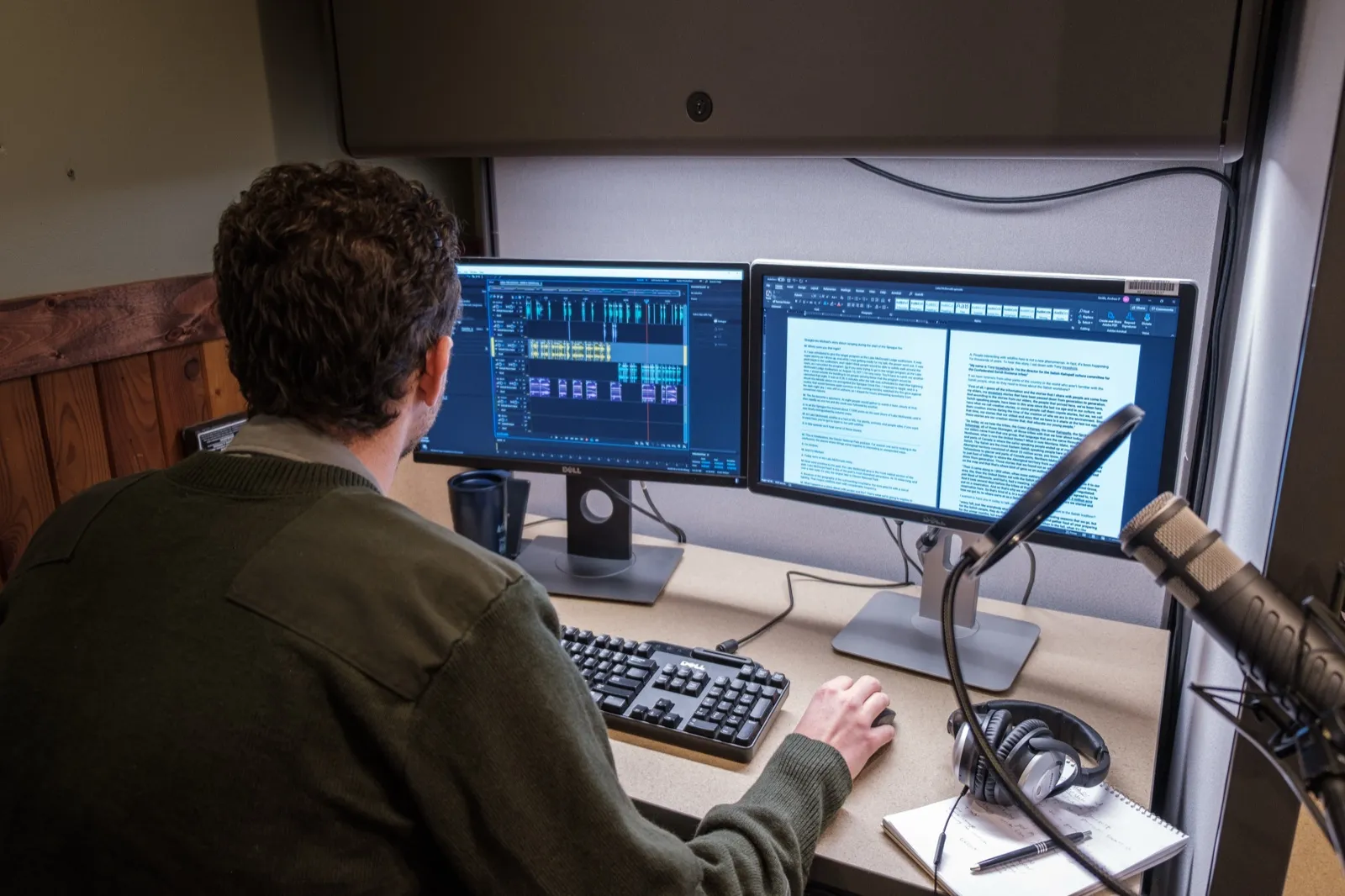 Editor working across two monitors, an editing timeline on one screen and the transcript on the other